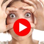 Woman with fingers pulling down eyelids.