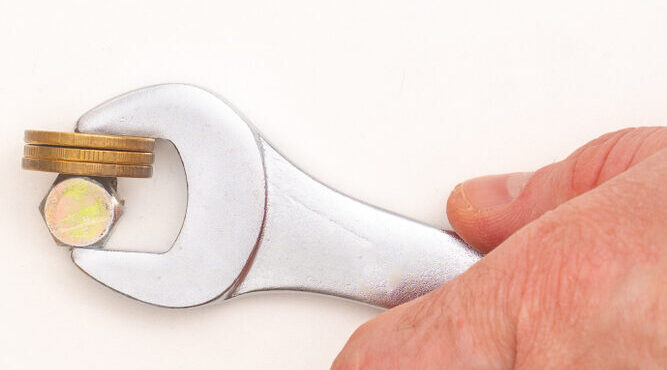 a wrench holding coins as a quick diy clamp